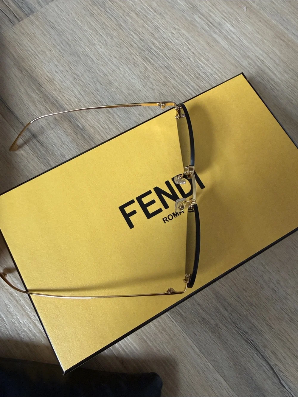 Fendi Slim Oval Sunglasses in Dark Brown and Gold